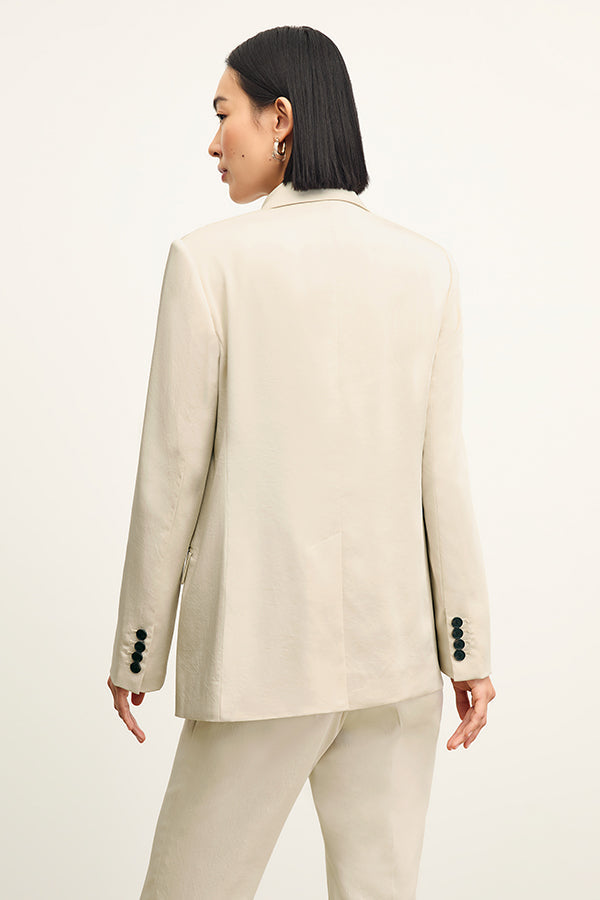 front image of a woman wearing the smith pant in champagne | Exclude