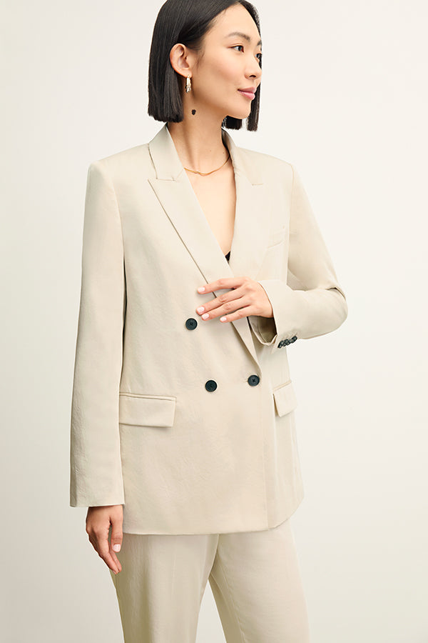front image of a woman wearing the smith pant in champagne | Exclude