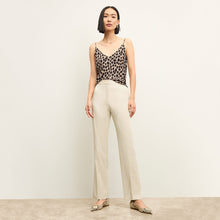 front image of a woman wearing the smith pant in champagne | Lead
