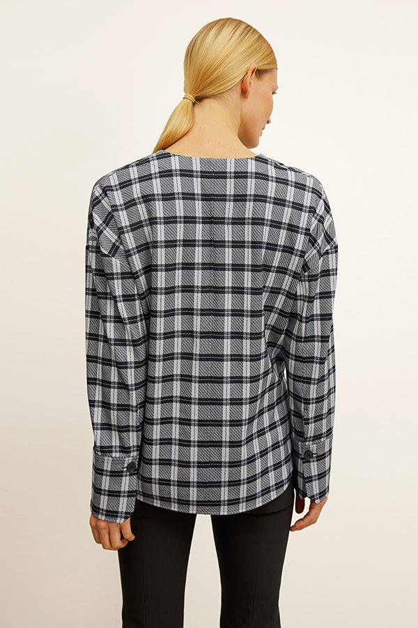 front image of a woman wearing the tully top in checkmate | Exclude