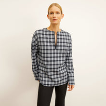 front image of a woman wearing the tully top in checkmate | Lead