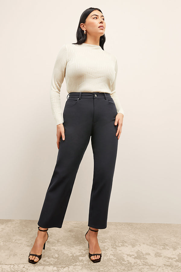front image of a woman wearing the brodie top in ivory | Exclude