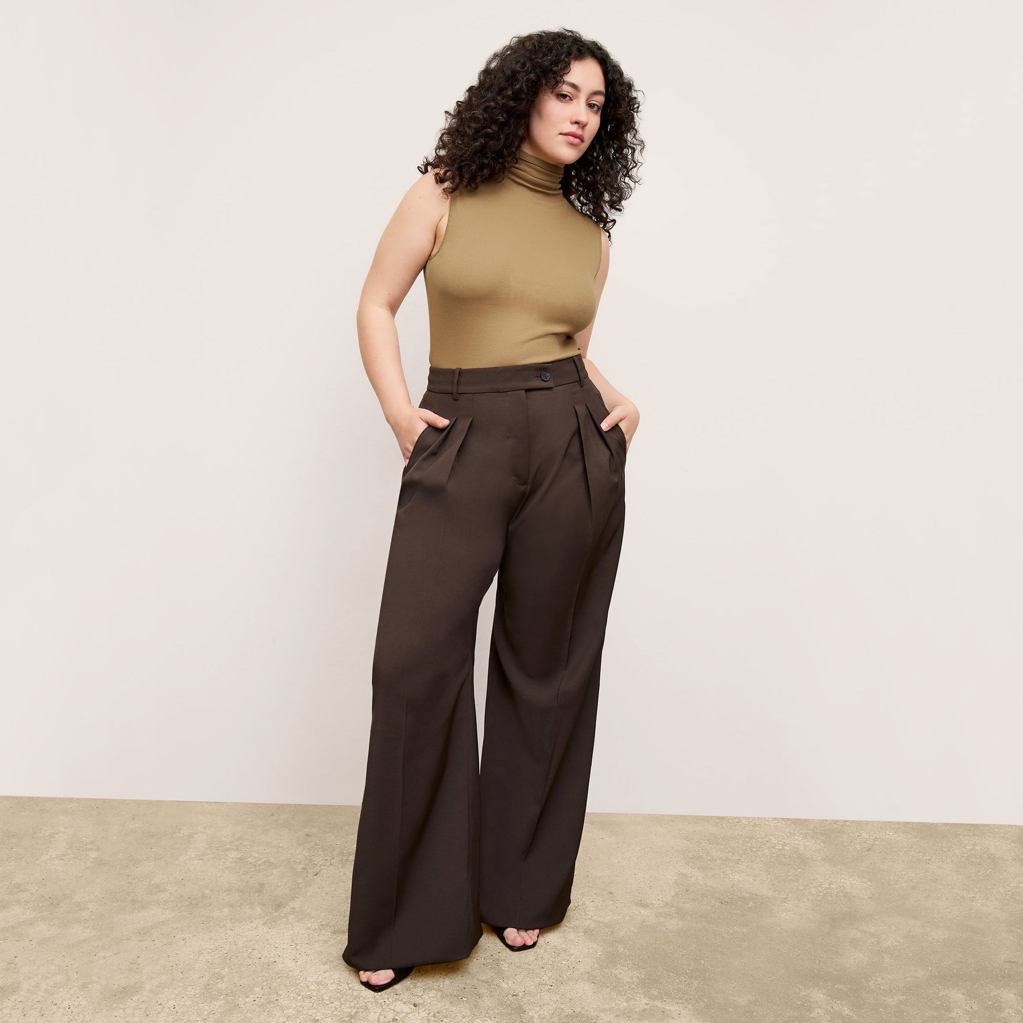 Front image of a woman wearing the Jett Tank in Saddle | Exclude