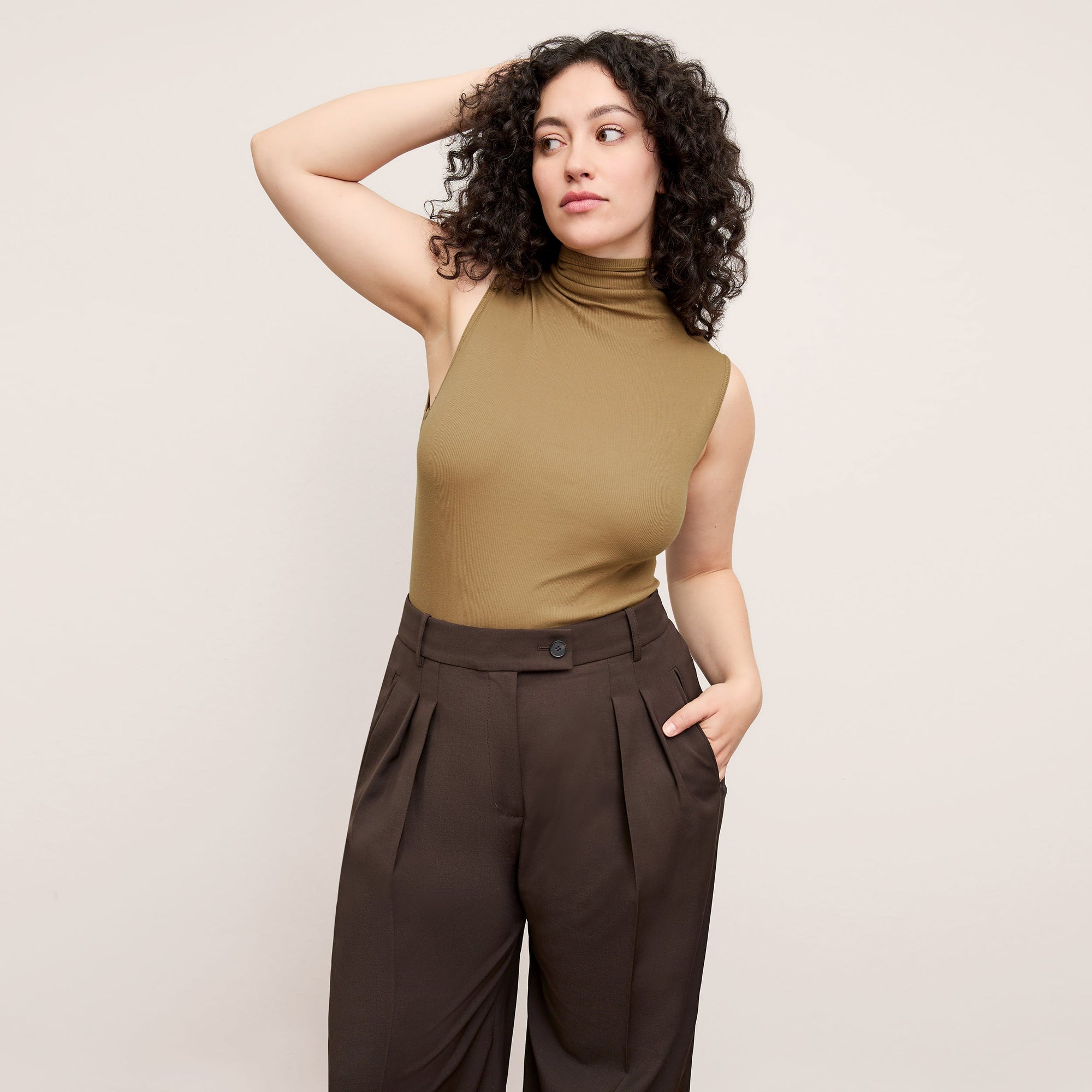 Front image of a woman wearing the Jett Tank in Saddle | Exclude