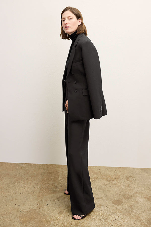 front image of a woman wearing the kati jacket in black | Exclude