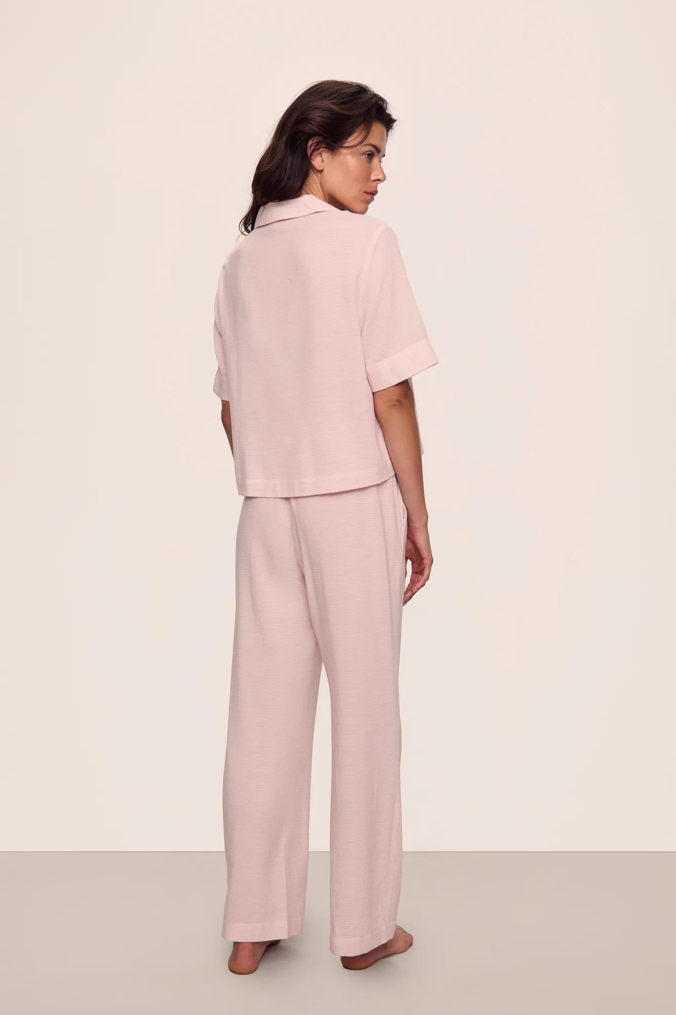 Model is wearing Nautico Relaxed Short Sleeve & Pant PJ Set in  Feeder Stripes Pale Mauve/White