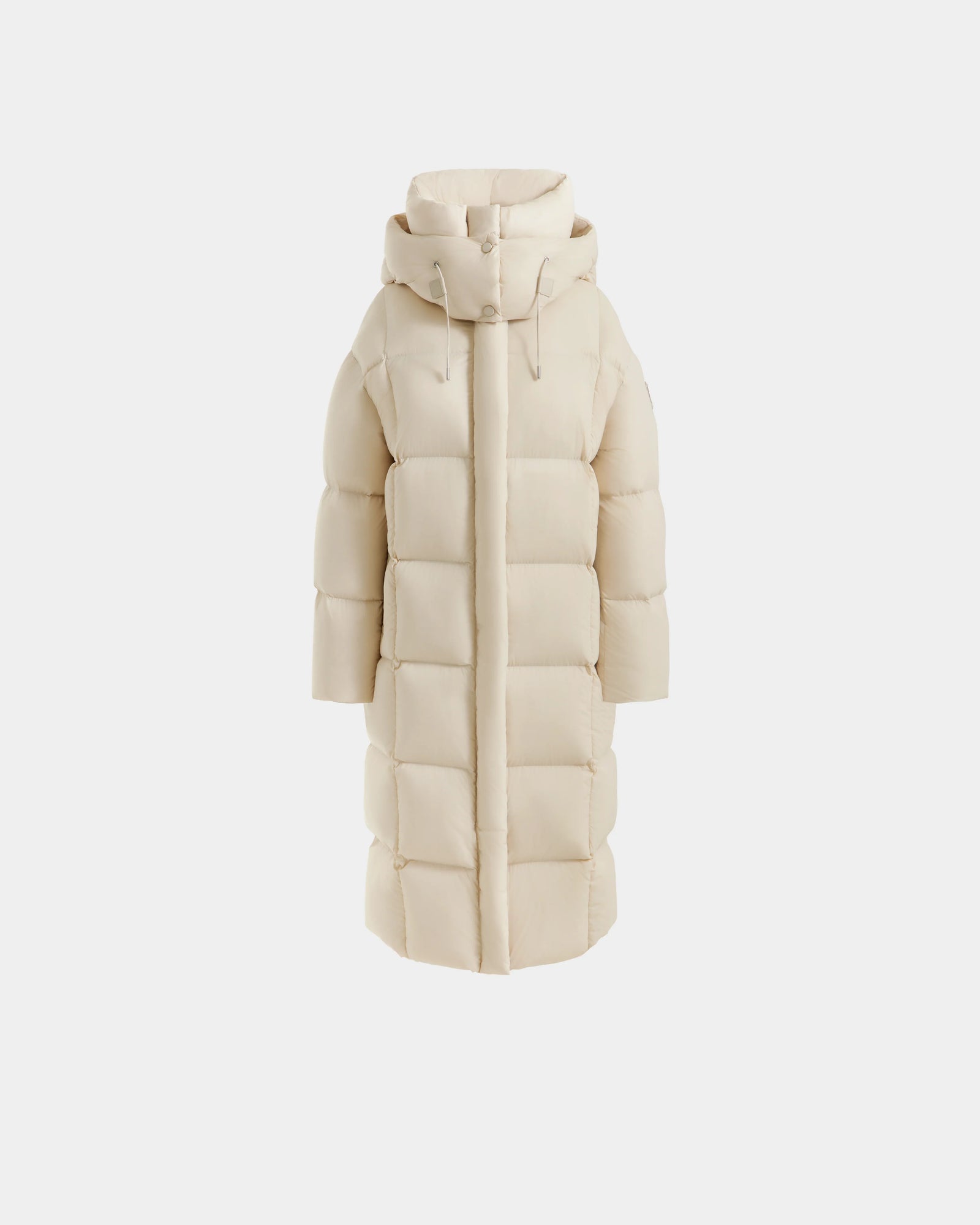 The Rudsak SASHA - 8125686 Vanilla is a women's long down puffer coat in cream with a front zipper, horizontal quilted stitching, and a removable hood, shown against a plain white background.